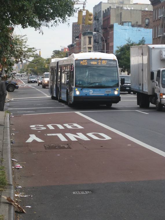 Both this SBS bus and the local bus ahead of it were forced out of their dedicated lane by a car idling in the right turn lane. Photo: Noah Kazis