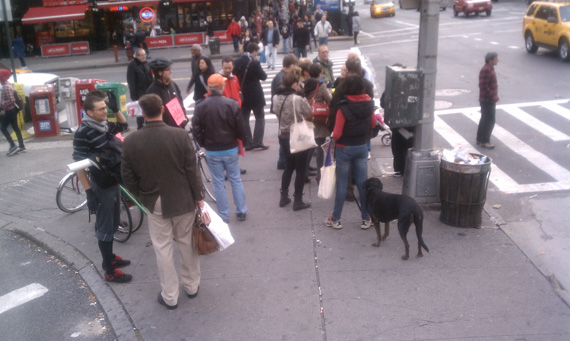 Most of the people in this frame are reporters or bike lanes supporters. The bike lane protestors are in a huddle by the light pole. Photo: Ben Fried