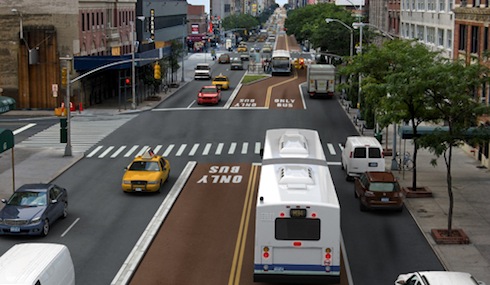 A rendering of the 34th Street Transitway shows how a design with a loading lane might shift to one without. Image: NYC DOT.