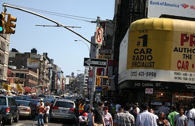 The only thing more congested than Canal Street might be Canal Street's sidewalks. Photo: via Flickr.
