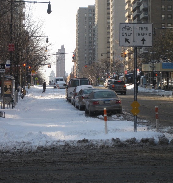 The new protected bike lane on Columbus Avenue remained unplowed at around 9:30 this morning. Photo: Noah Kazis.