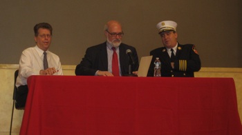 Fire Department officials listen members of the public, insurance industry reps, and politicians oppose their plans to charge for responding to traffic crashes. Photo: Noah Kazis.