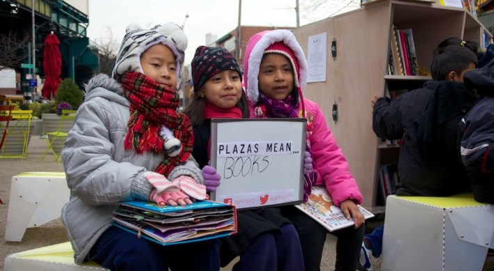 Students from P.S. 16 at The Uni reading room in Corona Plaza this morning. Photo: The Uni