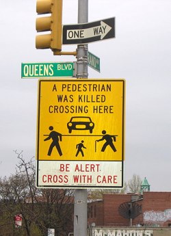 Queens Boulevard continues to be "a problem" for emergency physicians at Elmhurst and Jamaica Hospitals, along other area streets. Photo: ##http://en.wikipedia.org/wiki/File:QueensBlvd-GrandAve_PedWarning_Sign-Elmhurst.jpg##Wikipedia##