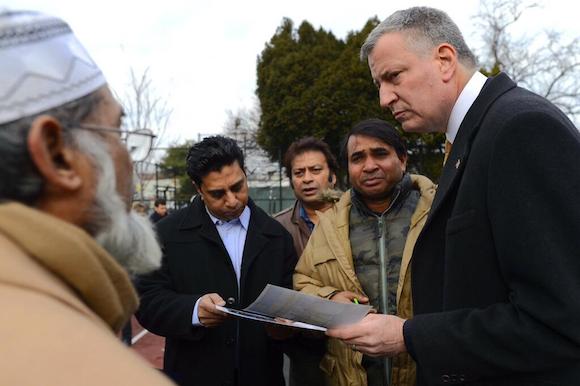 Mayor Bill de Blasio speaks with the family of Noshat Nahian, an 8-year-old killed while walking to school last month. Photo: NYC Mayor's Office
