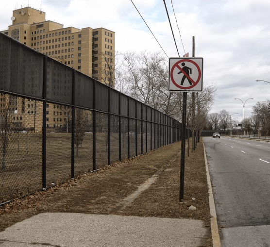 On Union Turnpike near Creedmoor Psychiatric Center, the sidewalk ends but the dirt path shows pedestrians still walk along the road. Photo: Angus Grieve Smith