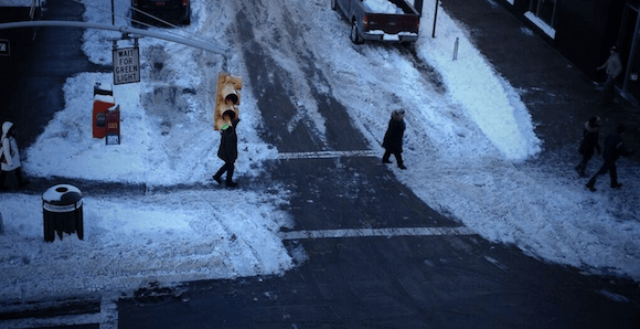 See those snowy spots in the road? Perfect opportunity for permanent traffic-calming curb extensions. Photo: Clarence Eckerson Jr.