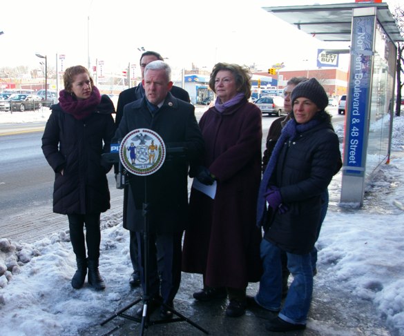 Advocates and fellow electeds with City Council Member Jimmy Van Bramer on Northern Boulevard, in front of a bus stop where five people were injured by a curb-jumping driver this month. Photo: Brad Aaron