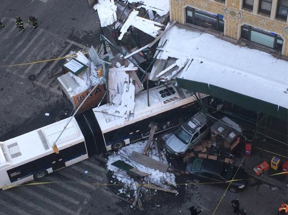 The driver of a stolen truck crashed into an MTA bus, killing the bus driver and injuring three others, including a food vendor who was on the sidewalk at Seventh Avenue and W. 14th Street. Photo: Daily News