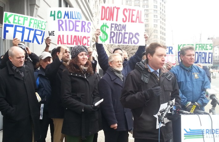 John Raskin of Riders Alliance speaks with some of the 32 Assembly members who signed a letter urging Speaker Sheldon Silver to take Governor Cuomo's transit raid out of the state budget. Photo: Stephen Miller