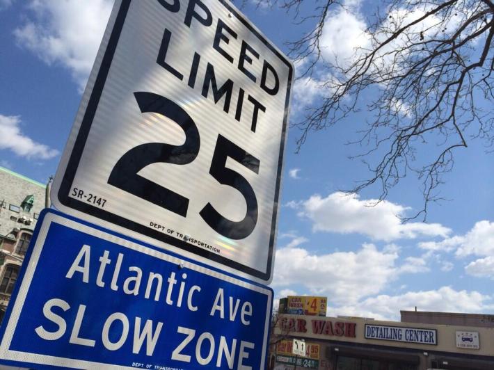 25 mph white-and-blue speed limit signs will join retimed lights on Atlantic Avenue and 24 other major streets. Photo: DHFixAtlantic/Twitter