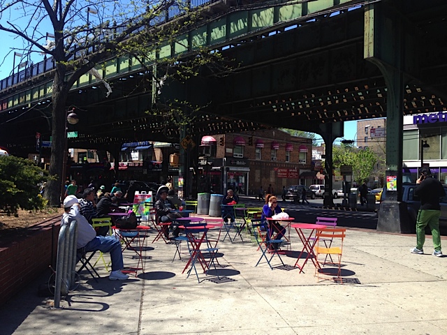 Manuel de Dios Unanue Triangle at Roosevelt Avenue and 83rd Street has received a seating upgrade. Photo: Clarence Eckerson Jr.