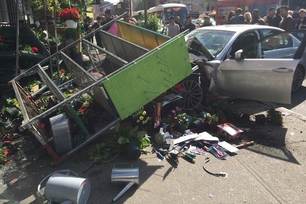 Two people were injured after a driver jumped the curb in the East Village, slamming into a hardware storefront. Photo: Twitter/@wlodarczyk