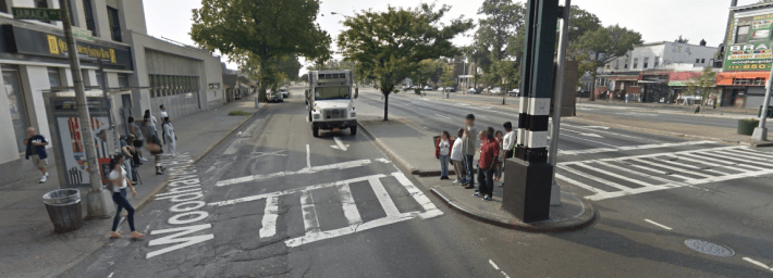 New York City can do better by bus riders and pedestrians on Woodhaven Boulevard, shown here at Jamaica Avenue. Photo: Google Maps