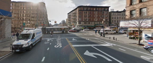 St. Nicholas Avenue at 145th Street, where a cyclist says she was nearly struck, and then harassed, by two NYPD officers in a marked patrol car. Image: Google Maps