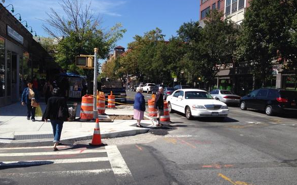 New curb extensions are popping up on 37th Avenue in Jackson Heights. Photo: Clarence Eckerson Jr.