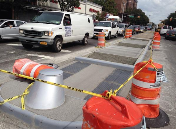 DOT has installed pedestrian islands on Northern Boulevard, including here at 89th Street. Photo: Clarence Eckerson Jr.