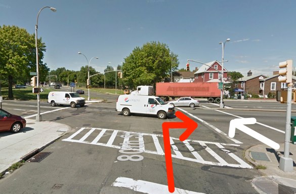 Melania Ward was struck by an MTA bus driver as she crossed Astoria Boulevard in Elmhurst. The red arrow represents the movement of the driver and the white arrow the movement of the victim, according to NYPD. Image: Google Maps