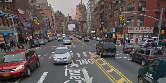Canal Street, looking west, at Elizabeth Street, where a driver struck and killed a senior this morning. NYPD and a witness says the victim was crossing south to north (left to right) when the driver waiting at the light accelerated into her when the signal changed.  Image: Google Maps