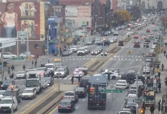 Police investigate the crash scene this afternoon. Photo: @JohnJayInNYC/Twitter