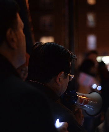 Council Member Peter Koo speaks at last night's vigil, with Council Member Mark Weprin in the foreground. Photo: Anna Zivarts/Flickr