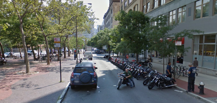 The plaza on the left is getting refurbished, but a shared space plan for this street was tabled in part because it's used as a display space for a motorcycle dealership. Photo: Google Maps