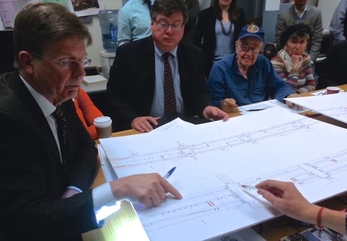 Queens Community Board 2 transportation committee chair Joseph Conley, left, looks at DOT's plan for Queens Boulevard in Woodside. Photo: Stephen Miller