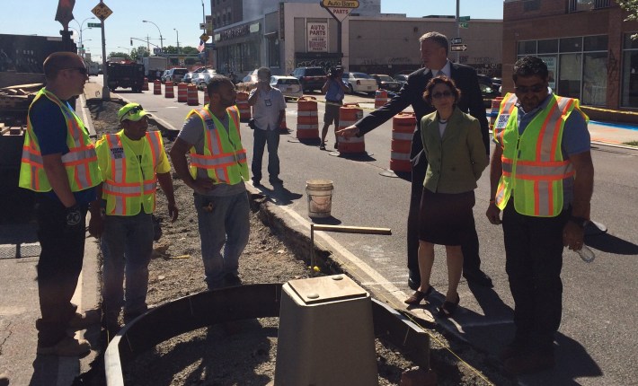 Mayor Bill de Blasio and Transportation Commissioner Polly Trottenberg visit work crews on Queens Boulevard this morning. Photo: Stephen Miller