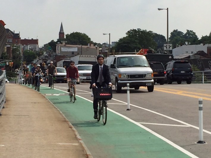 Cyclists, led by DOT Assistant Commissioner Ryan Russo, ride over the newly-completed Greenpoint Avenue Bridge bike lanes. Photo: Clarence Eckerson Jr.