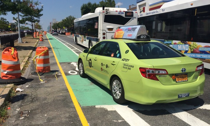 Adding some protection to these bike lanes, which are slated to get flexible bollards, can't happen soon enough. Photo: Stephen Miller