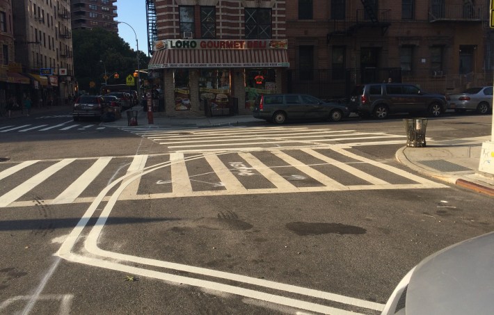 A curb extension being painted on Clinton Street at Henry Street. Photo: Stephen Miller