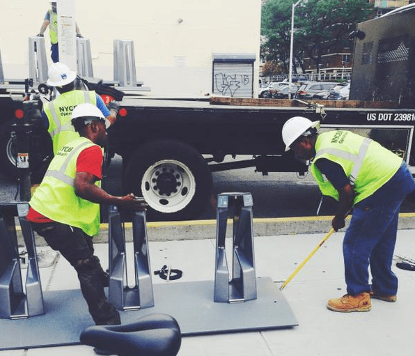 A Citi Bike crew installs a station at Broadway and Boerum Street. Photo: Citi Bike/Twitter