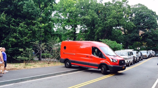 A van driver attempts to turn around, using a Prospect Park sidewalk. Photo: Stanley Greenberg