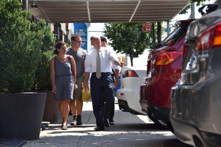 Council Member Jimmy Van Bramer isn't shopping for a new car at City Mitsubishi's dealership. He's trying to walk down the sidewalk on Northern Boulevard. Photo:  John McCarten/NYC Council