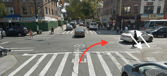 The white arrow indicates the approximate path of Lubov Brodskaya - it’s unknown if she was walking north or south - and the red arrow indicates the approximate path of the FedEx driver who killed her at E. 12th Street and Avenue J. Image: Google Maps