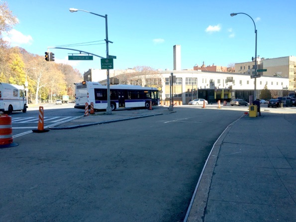 Drivers must make slower turns from Broadway onto Sherman Avenue after DOT eliminated a slip lane, now covered with epoxy, in the foreground. Photo: Brad Aaron