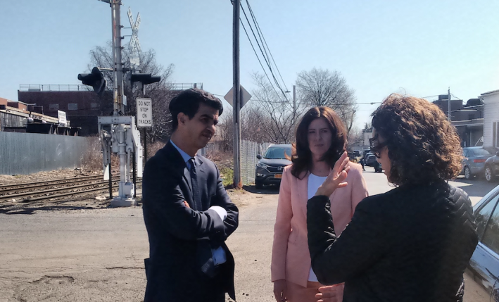 Council Transportation Chair Ydanis Rodriguez, left, and Council Member Elizabeth Crowley, center, discuss transit concerns on a tour of transit-strapped central Queens. Photo: David Meyer