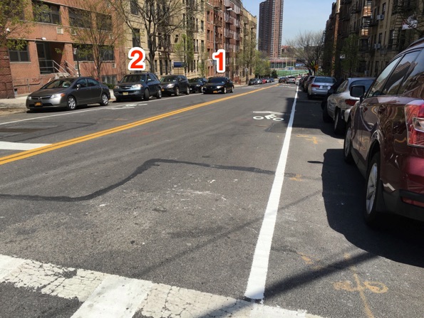 … and looking north, where the northbound bike lane turns to sharrows. Driver 1 is backing down the street for parking. Driver 2 is about to make a U turn. Photos: Brad Aaron