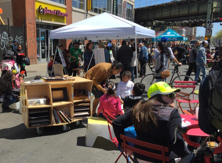 Kids and parents enjoyed a pop-up library at the plaza demo. Photo: David Meyer