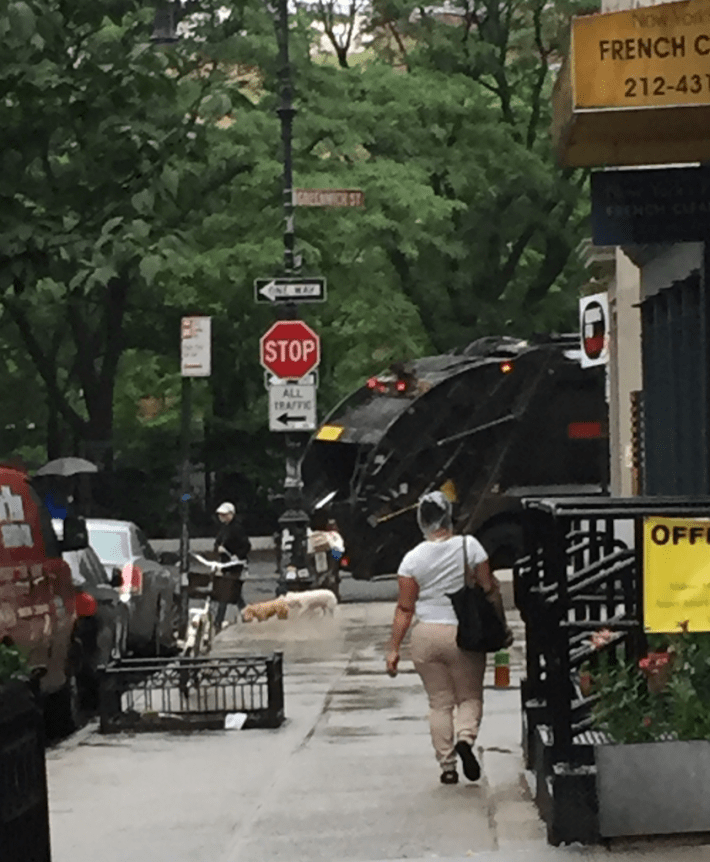 An Action Carting worker driving against traffic on one-way Greenwich Street in front PS 150 in Tribeca this morning. Photo: Jennifer Aaron