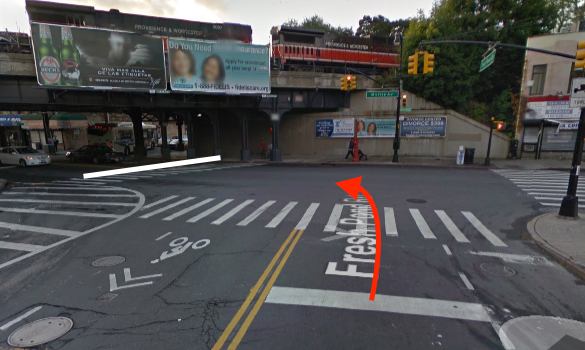 A driver turning left fatally struck Mary Alice D’Amico as she crossed Myrtle Avenue at Fresh Pond Road. The white line represents D’Amico’s path through the intersection — it is unknown which direction she was walking — and the red arrow indicates the path of the driver. Image: Google Maps