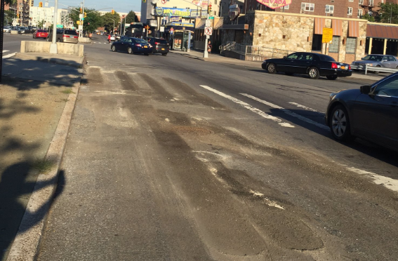 DOT has began removing street markings on the blocks where it will soon install a protected bike lane and pedestrian path. Photo: Jessame Hannus