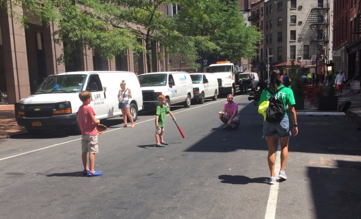 A new sight in old New York: Children playing ball in the street during DOT's "Shared Streets" event on Saturday.
