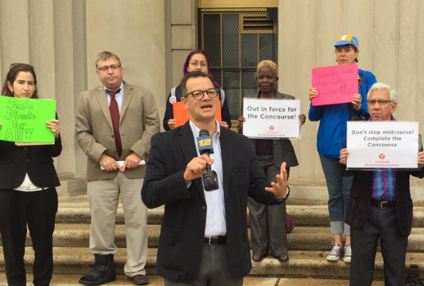 Council Member Andrew Cohen speaks in favor of the "Complete the Concourse" in front of the Bronx County Courthouse. Photo: David Meyer