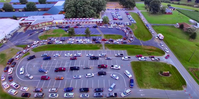 The double-wide snake of cars in the parking lot didn't solve the problem. Via David Bruce/YouTube