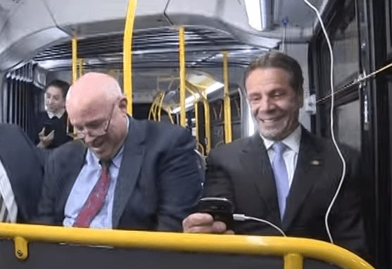 Cuomo on a bus playing with USB