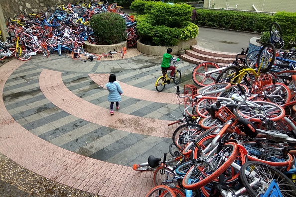 Abandoned bike-share bikes near the entrance of Xiashan park in Shenzhen. Photo: STR/AFP/Getty Images