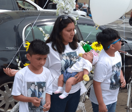 Gelacio Reyes' wife Flor Jimenez and their three children at Saturday's memorial. Photo: Macartney Morris