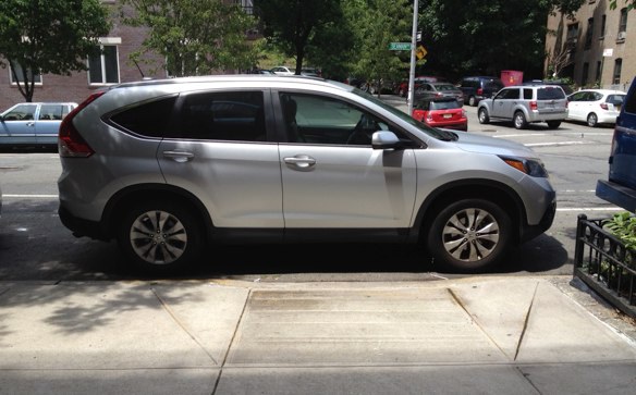 Before a 2009 DOT rule change it was illegal to block curb ramps at unmarked crosswalks. Photo: Brad Aaron