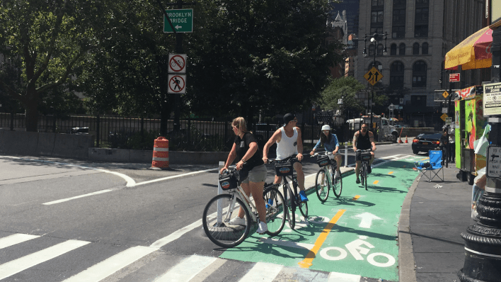Cyclists use this new bike lane this morning to queue up at the entrance to the Brooklyn Bridge. Photo: David Meyer